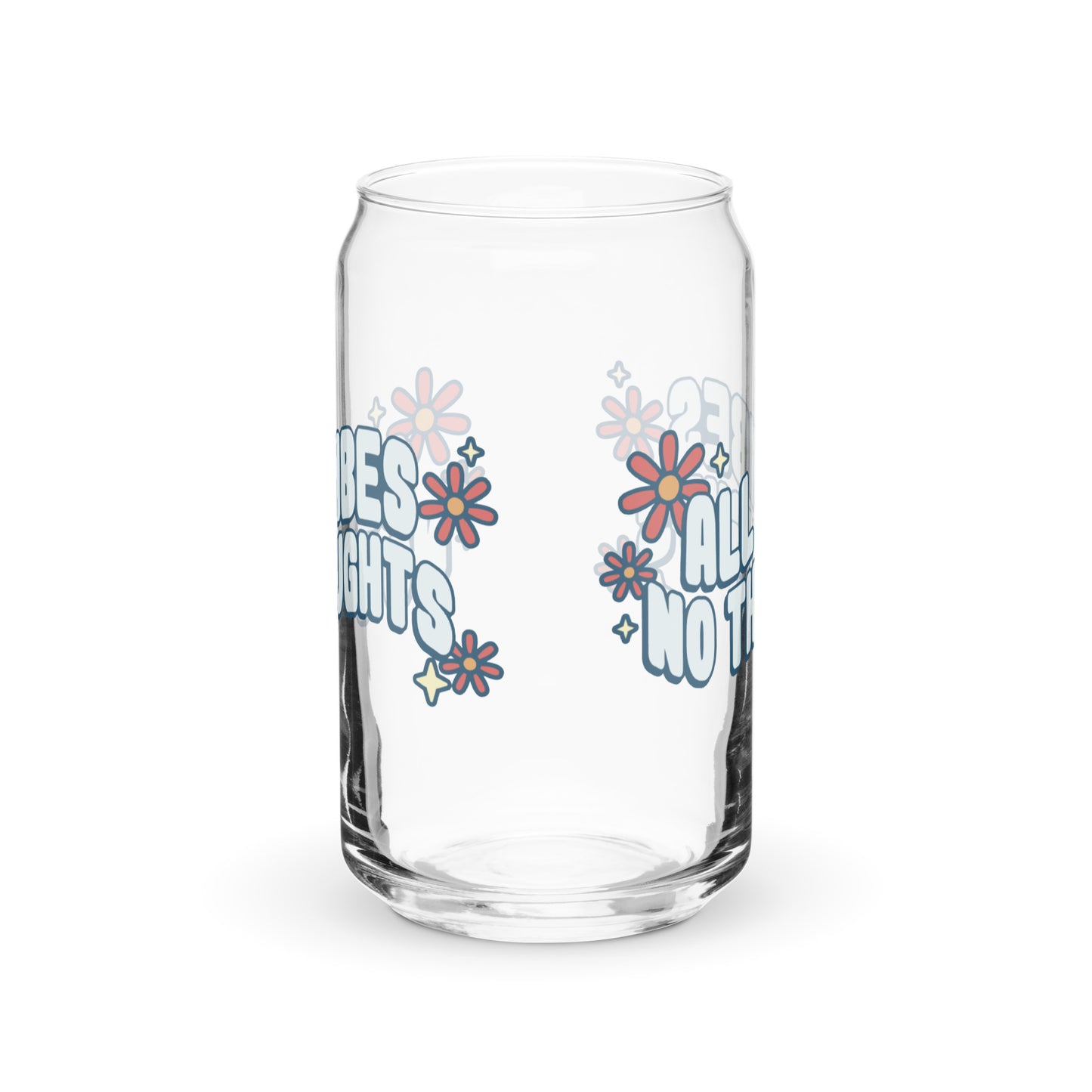 A side view of a can-shaped glass. Part of the image on the glass is visible to show that the graphic is printed on two sides of the glass.