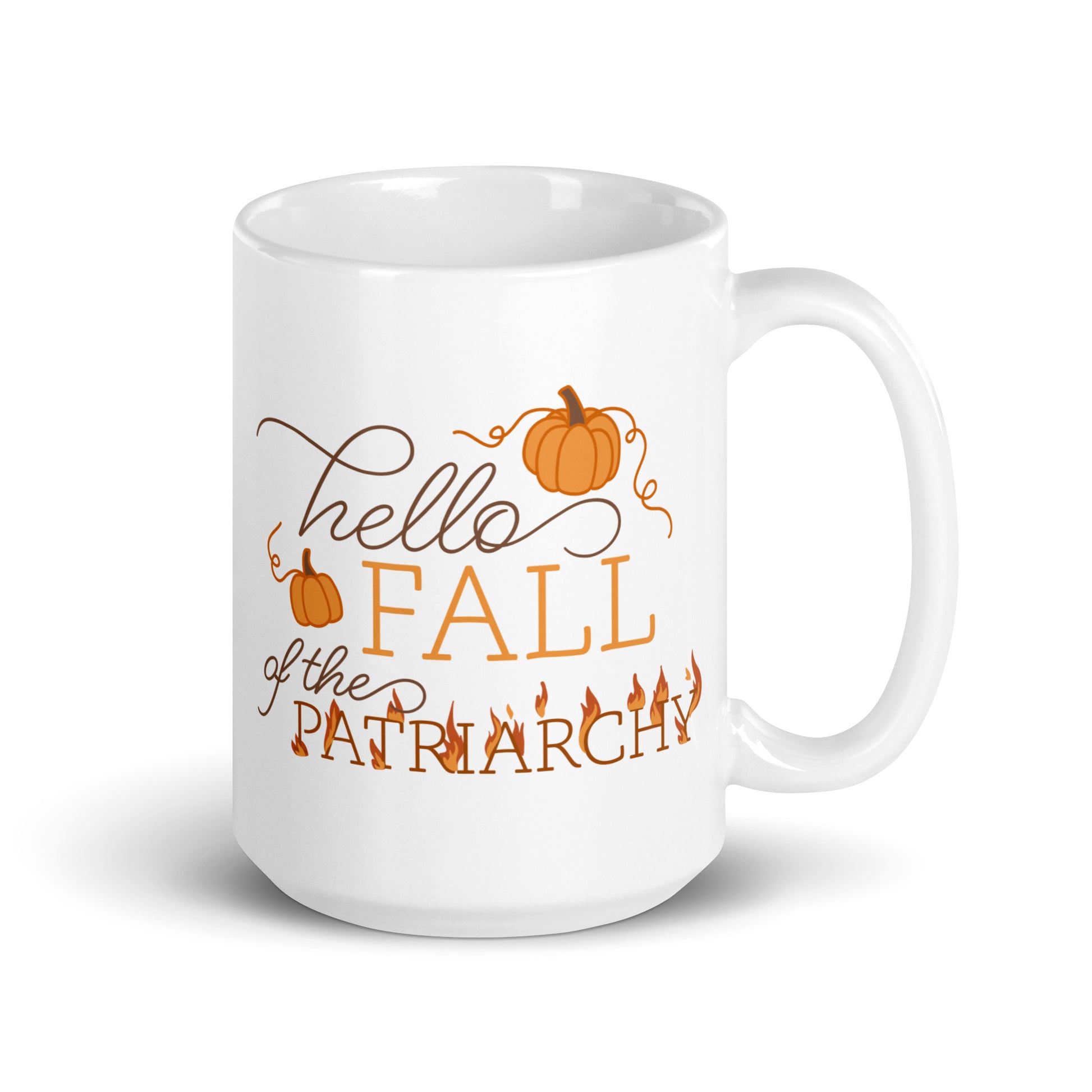 A white ceramic coffee mug featuring text in a blend of cursive and serif fonts that read "hello FALL of the PATRIARCHY". Pumpkins surround the upper half of the text, and the word "Patriarchy" is surrounded by flames.
