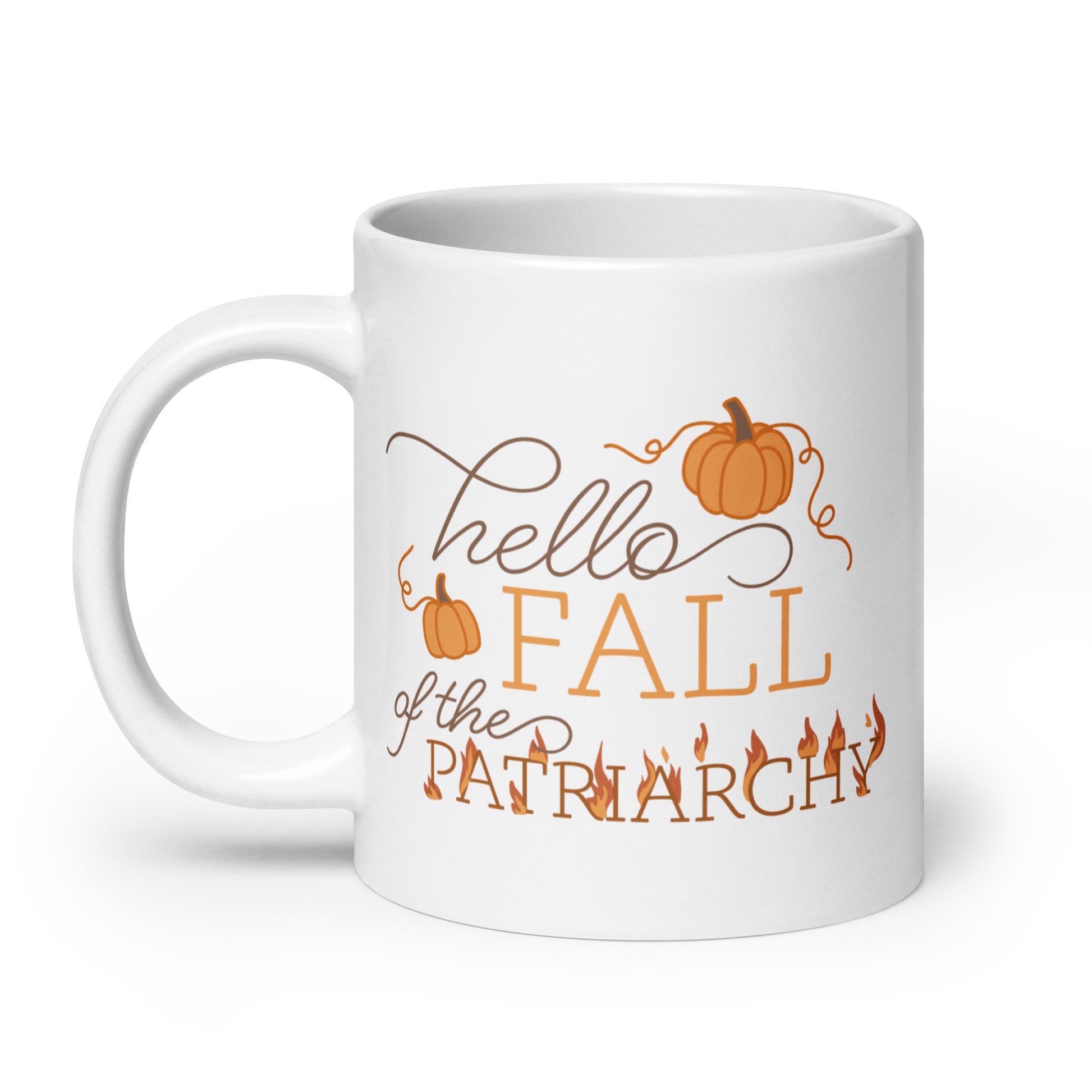 A white ceramic coffee mug featuring text in a blend of cursive and serif fonts that read "hello FALL of the PATRIARCHY". Pumpkins surround the upper half of the text, and the word "Patriarchy" is surrounded by flames.