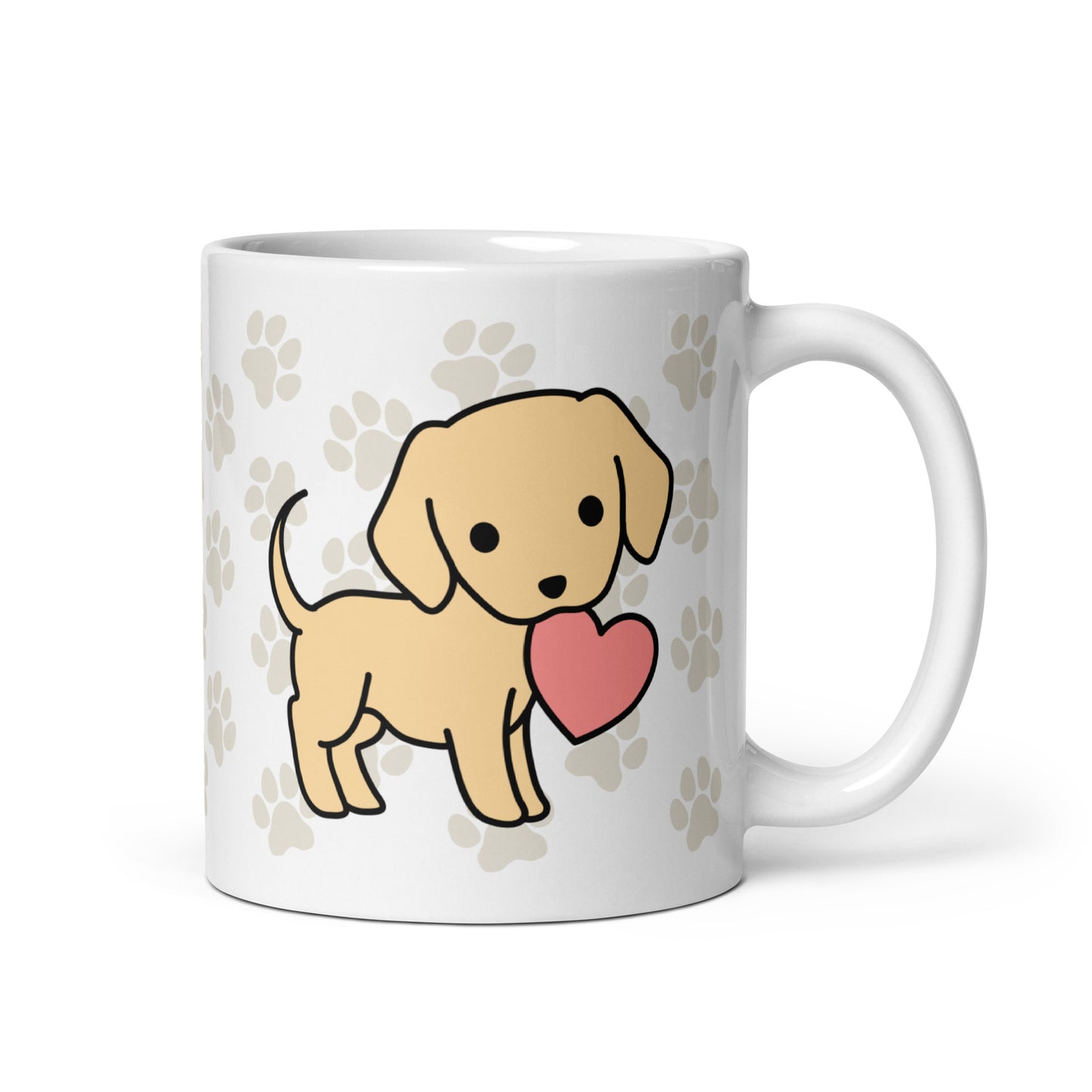 A white 11 ounce ceramic mug with a pattern of light brown pawprints all over. The mug also features a stylized illustration of a Yellow Lab holding a heart in its mouth.