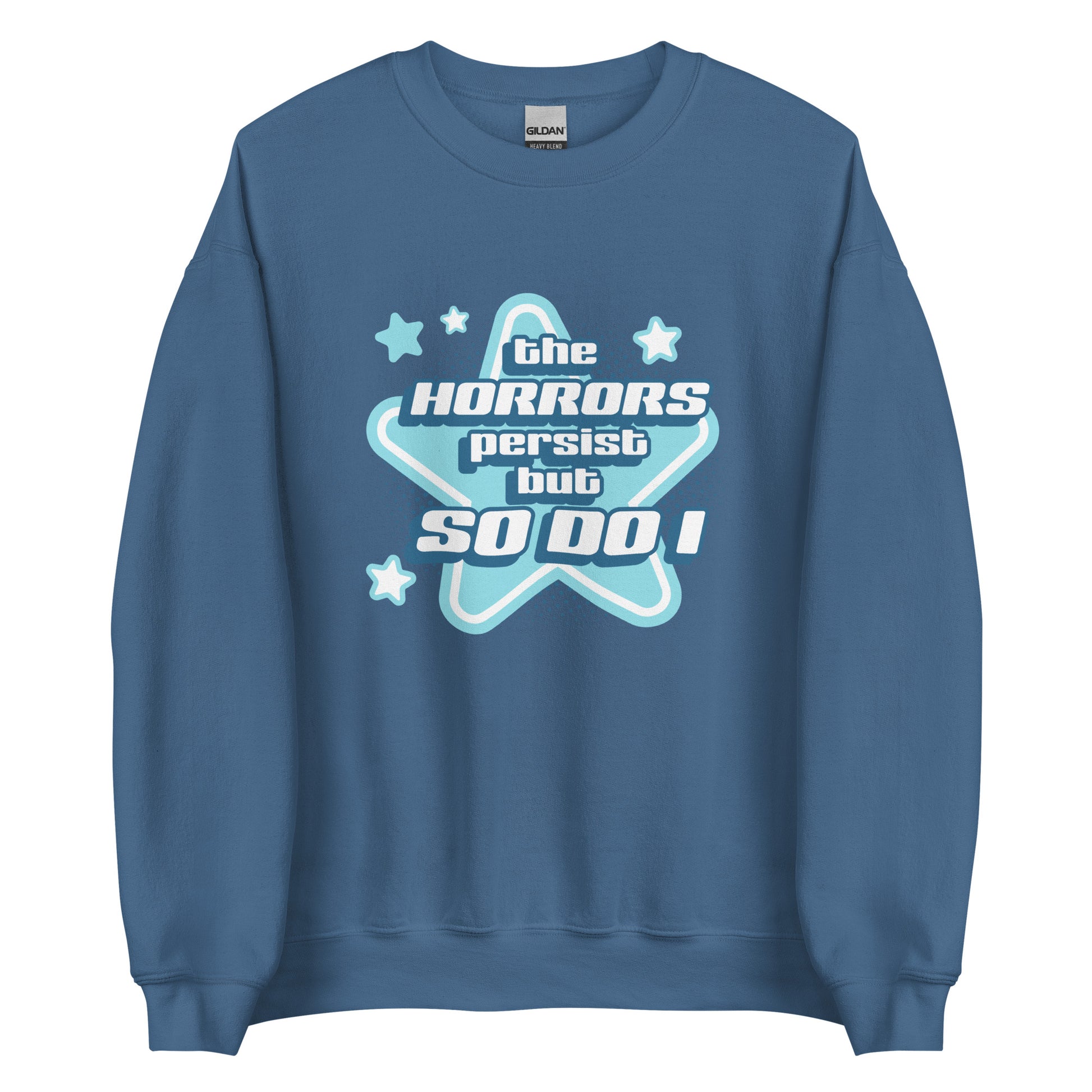 A blue crewneck sweatshirt featuring blue and white stars over a halftone pattern with chunky text that reads "the horrors persist but so do i".