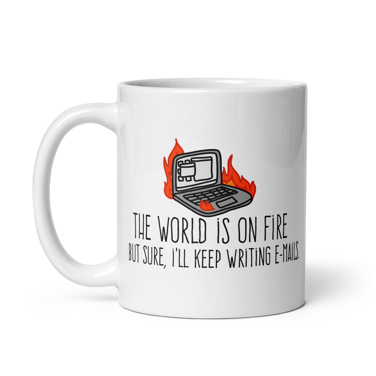 A white ceramic mug featuring a wobbly illustration of a laptop on fire. Text underneath the laptop reads "The world is on fire but sure, I'll keep writing e-mails"