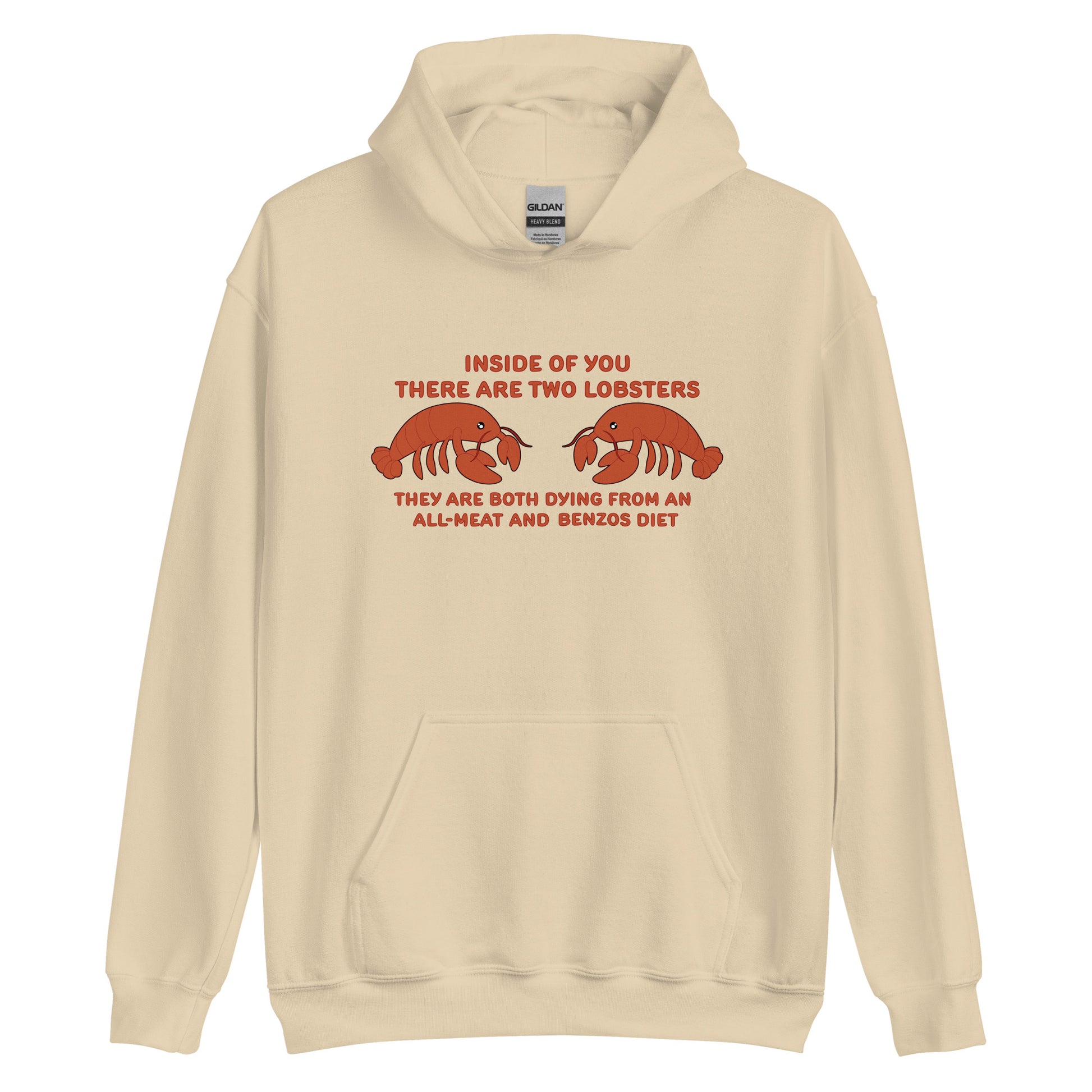 A beige hooded sweatshirt featuring an illustration of two lobsters. Text around the lobster reads "Inside Of You There Are Two Lobsters" "They are both dying from an all-meat and benzos diet."