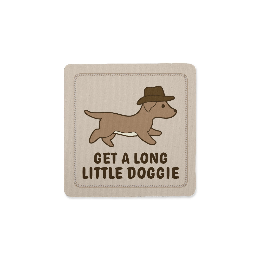 A square coaster with an image of a dachshund in a cowboy hat. Text below the dog reads "Get a long little doggie"