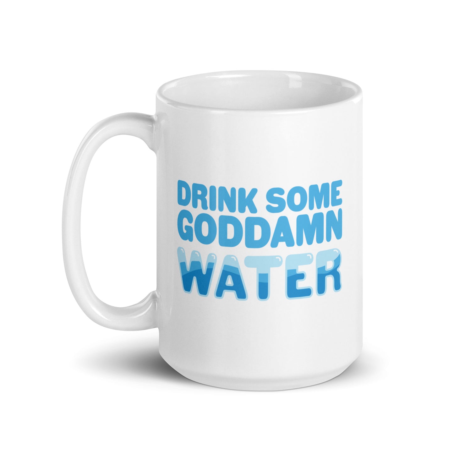 A white 15 ounce ceramic mug with blue bubble letters that read "Drink some goddamn water"