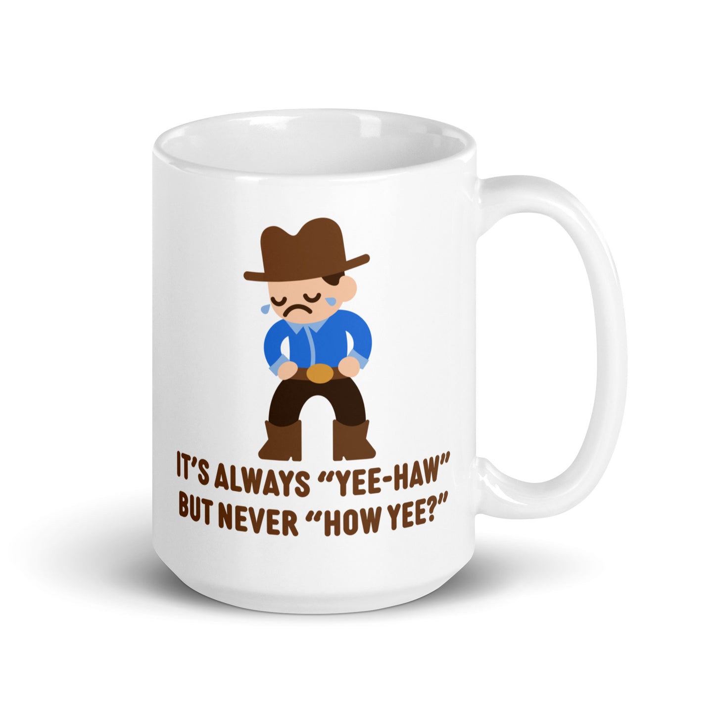 A white 15 ounce ceramic coffee mug featuring an illustration of a crying cowboy wearing a blue shirt. Text below the cowboy reads "It's always "yee-haw" but never "How yee?""