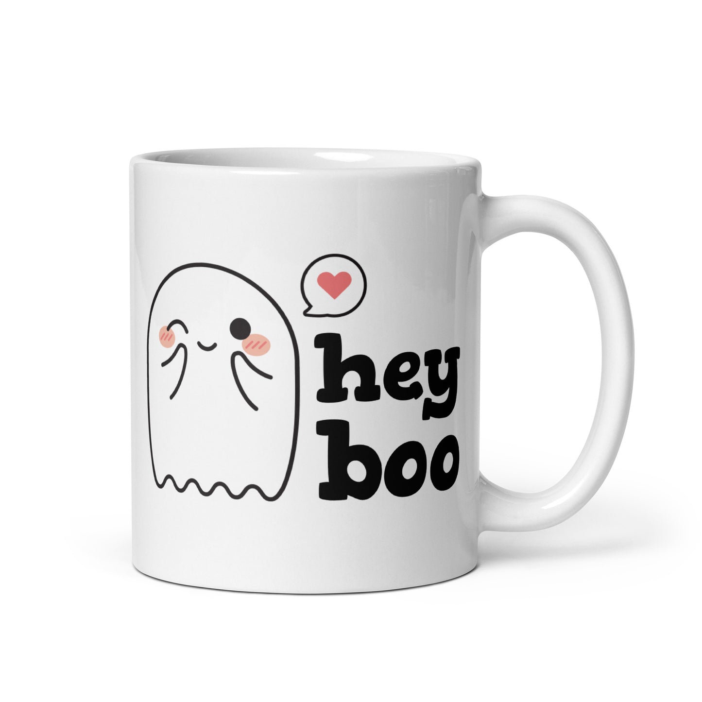 A white 11 ounce coffee mug featuring an illustration of a blushing and smiling ghost next to text that reads "hey boo"