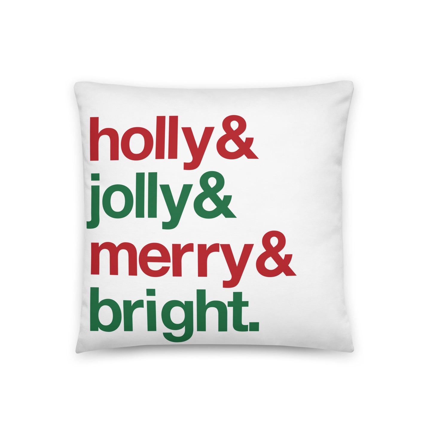 An 18" by 18" throw pillow decorated with four lines of red and green text that read "Holly & jolly & merry & bright".