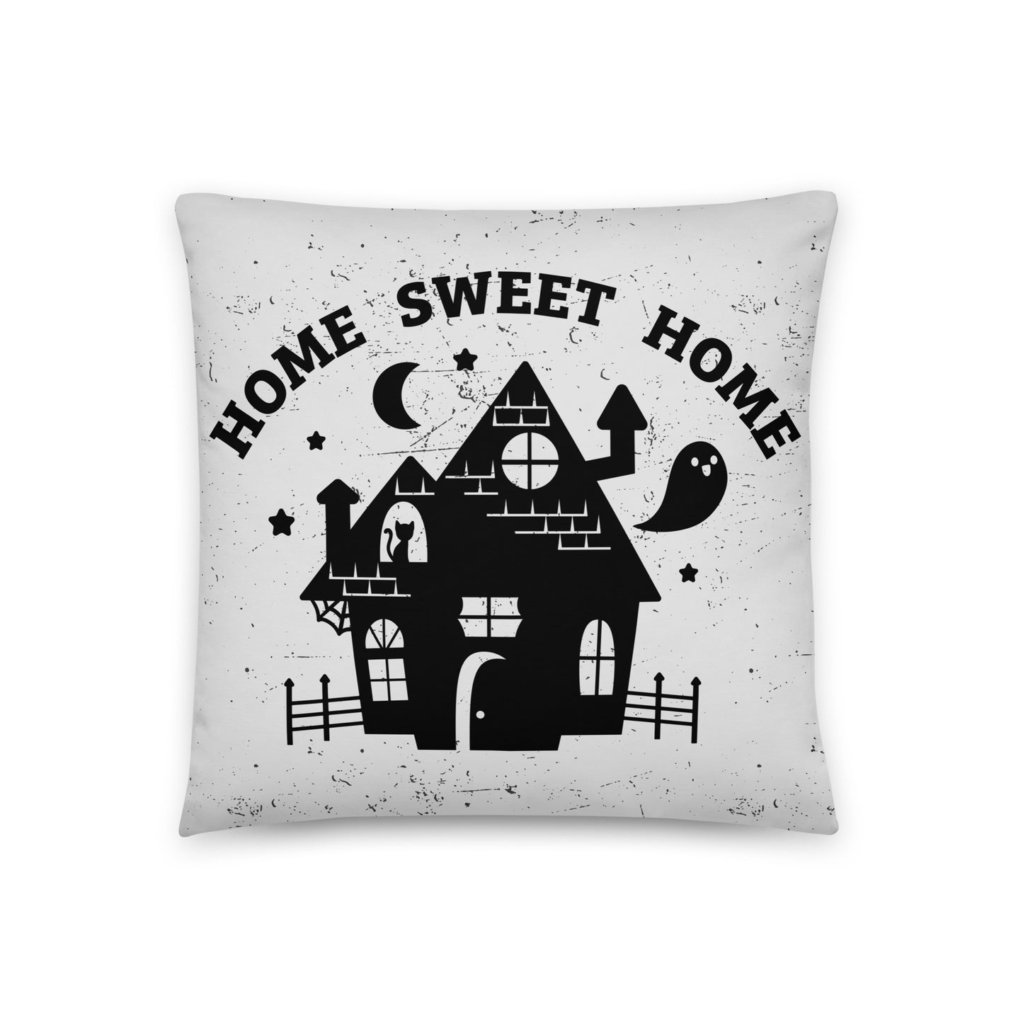 A white throw pillow with a black illustration of a haunted house and text reading "home sweet home".