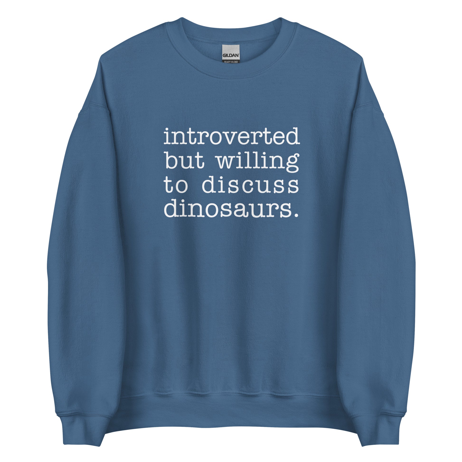 A blue crewneck sweatshirt with white text reading "introverted but willing to discuss dinosaurs"