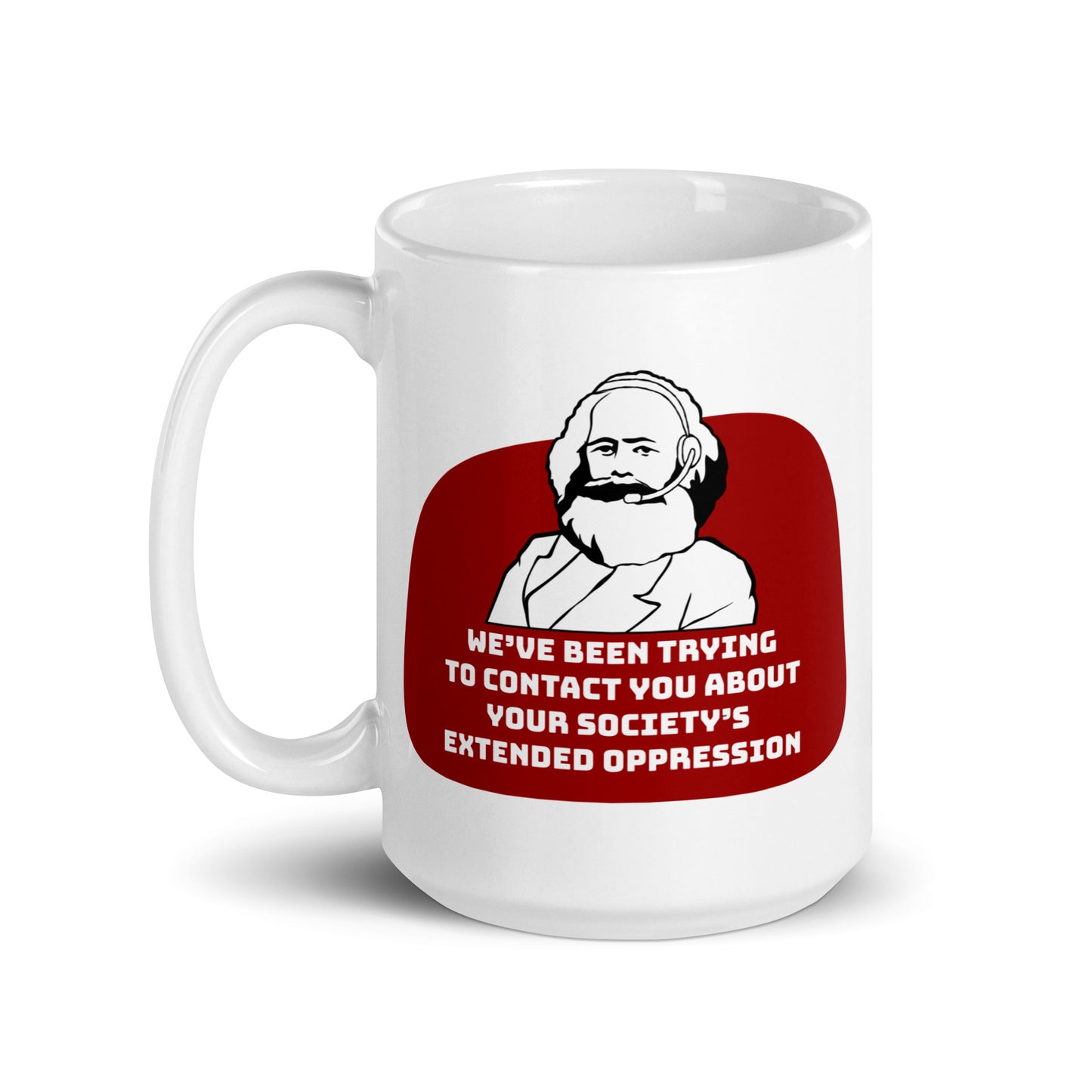 A 15 ounce, white ceramic mug featuring a black and white illustration of Karl Marx wearing a telemarketer headset. Text beneath Marx reads "We've been trying to contact you about your society's extended oppression." in a blocky font.