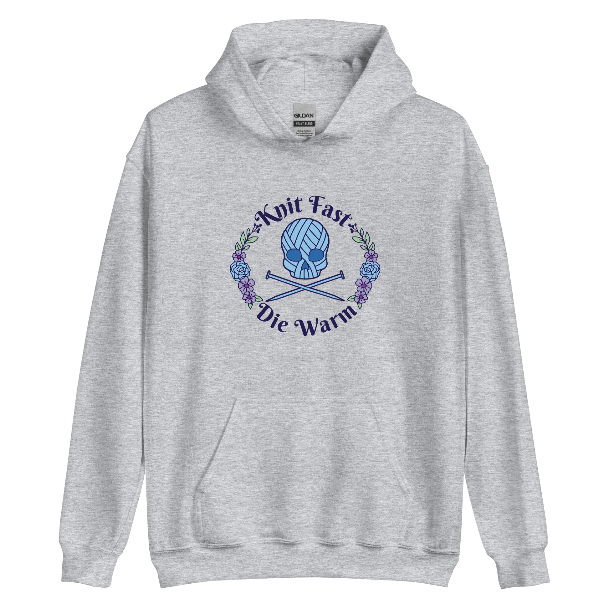 A heather grey hooded sweatshirt featuring an image of a skull and crossbones made of yarn and knitting needles. A floral wreath surrounds the skull, along with words that read "Knit Fast, Die Warm"