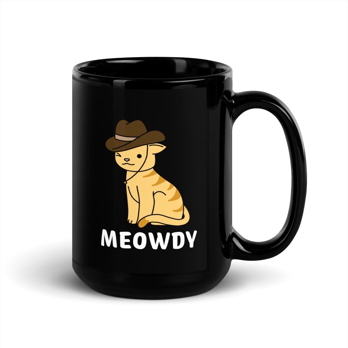 A black 15 ounce ceramic coffee mug featuring an illustration of an orange striped cat wearing a cowboy hat. The cat is winking and smiling, and text beneath him reads "Meowdy"