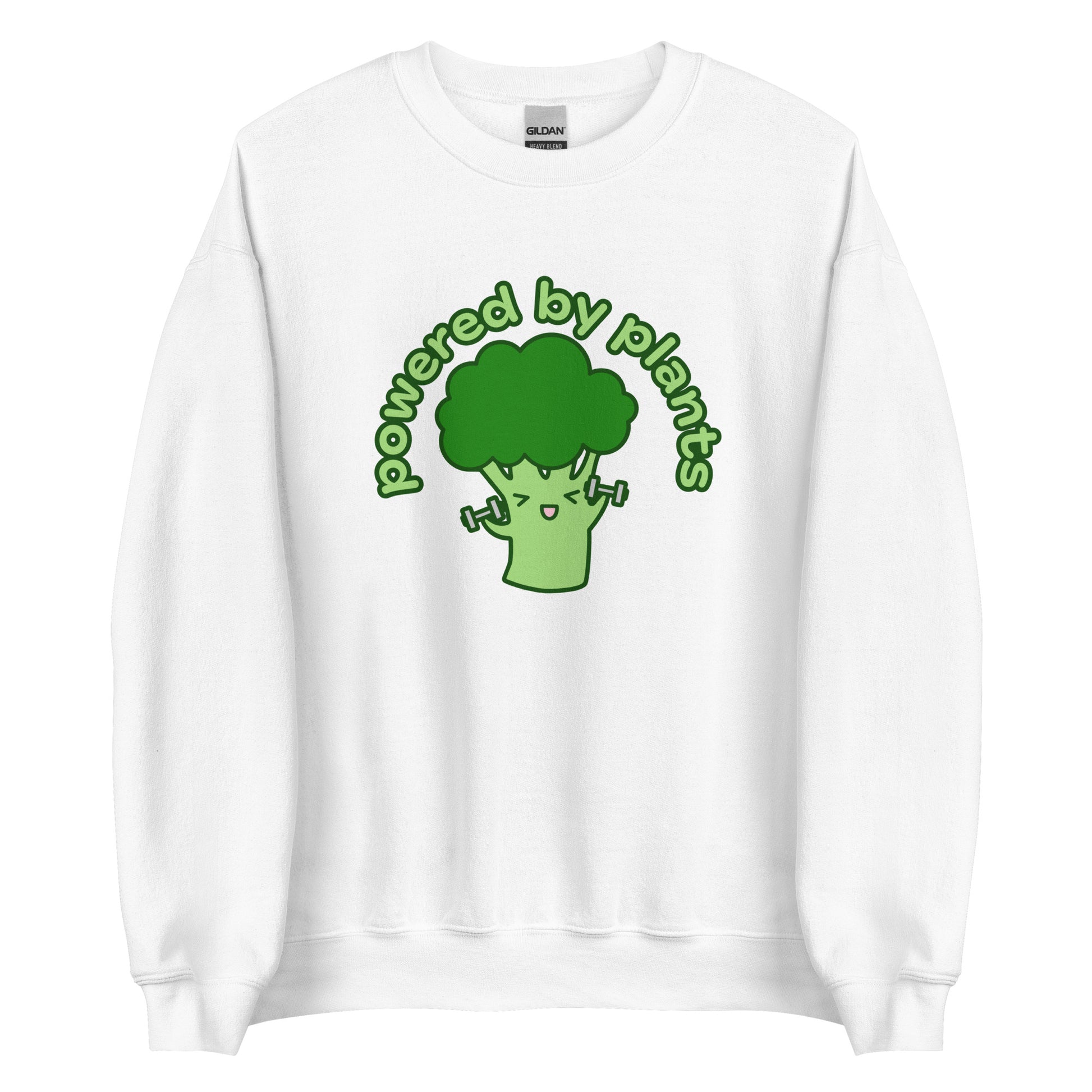 A white crewneck sweatshirt featuring an illustration of a cartoon broccoli character. The broccoli is excitedly lifting weights, and text in an arc above the broccoli reads "powered by plants".