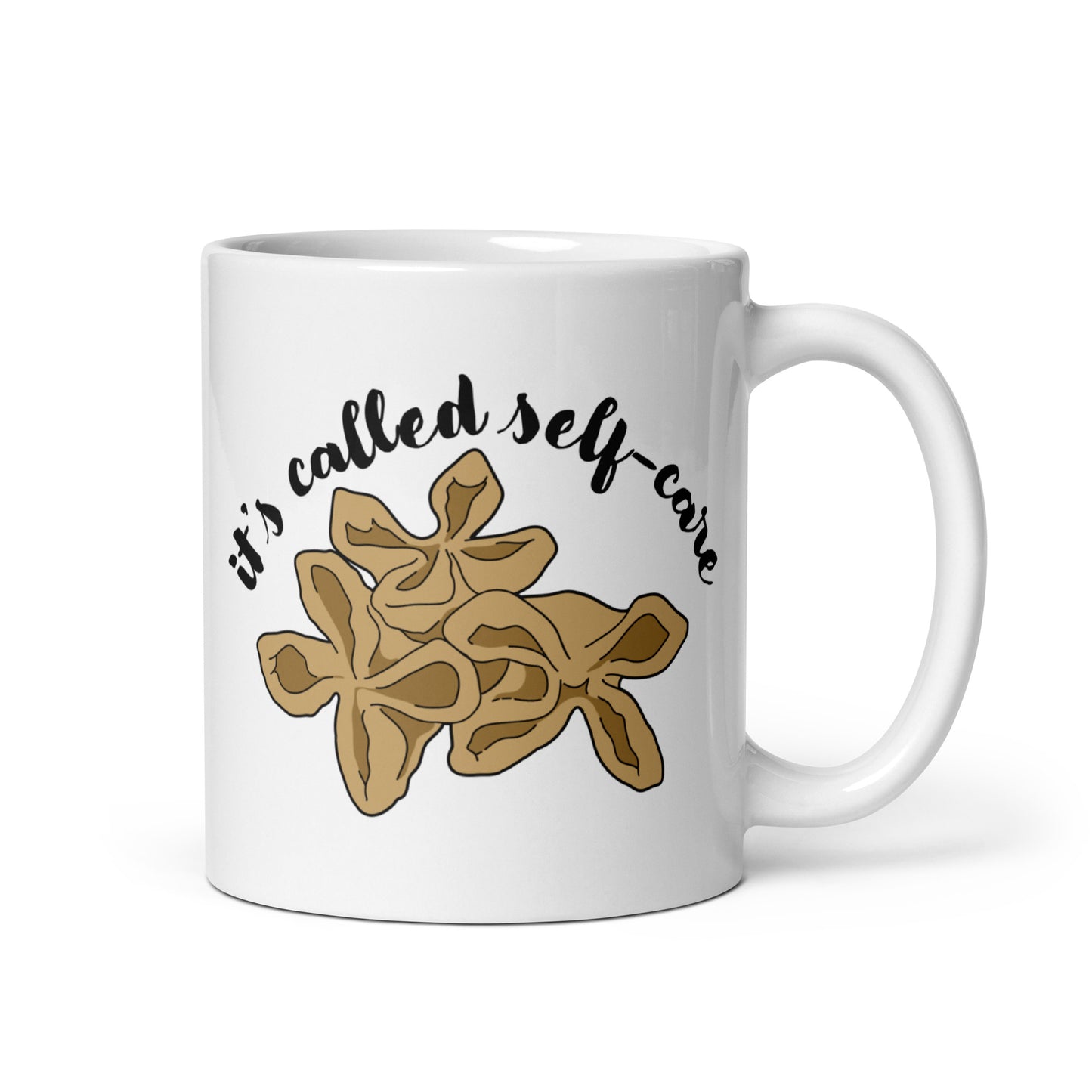 A white, 11 ounce ceramic mug featuring an illustration of three pieces of crab rangoon. Text in an arc above the crab rangoon reads "it's called self-care" in a cursive script.