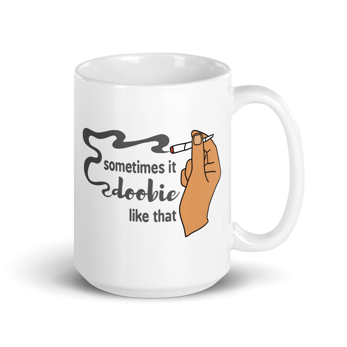A white 15 ounce ceramic coffee cup featuring an illustration of a hand with medium-toned skin holding a joint. Text alongside the hand reads "sometimes it doobie like that" with the word "doobie" made from smoke from the joint.