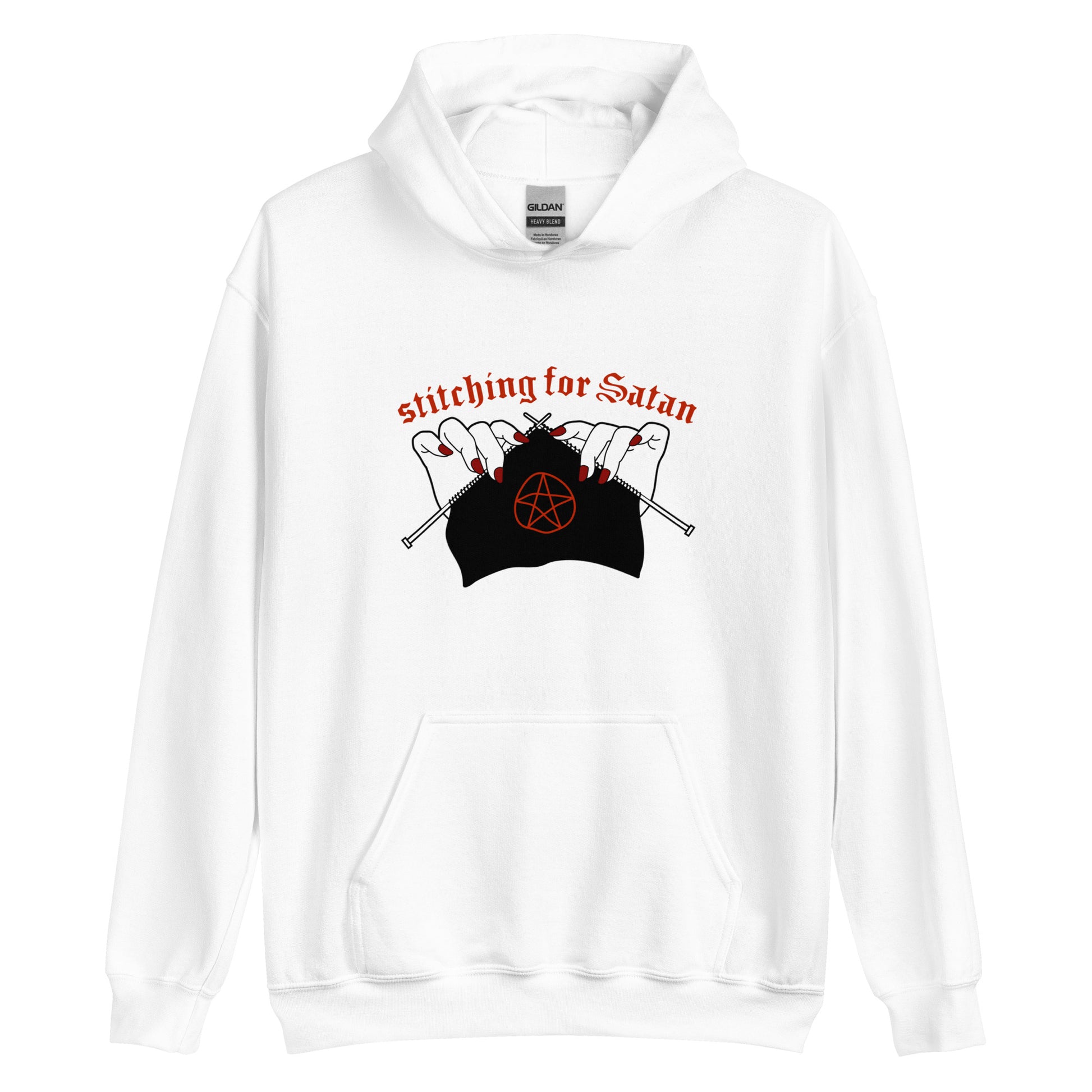 A white hooded sweatshirt featuring an illustration of pale white hands with red fingernails holding knitting needles. Fabric on the needles features a red pentagram. Text above the hands reads "stitching for Satan" in a gothc red font.