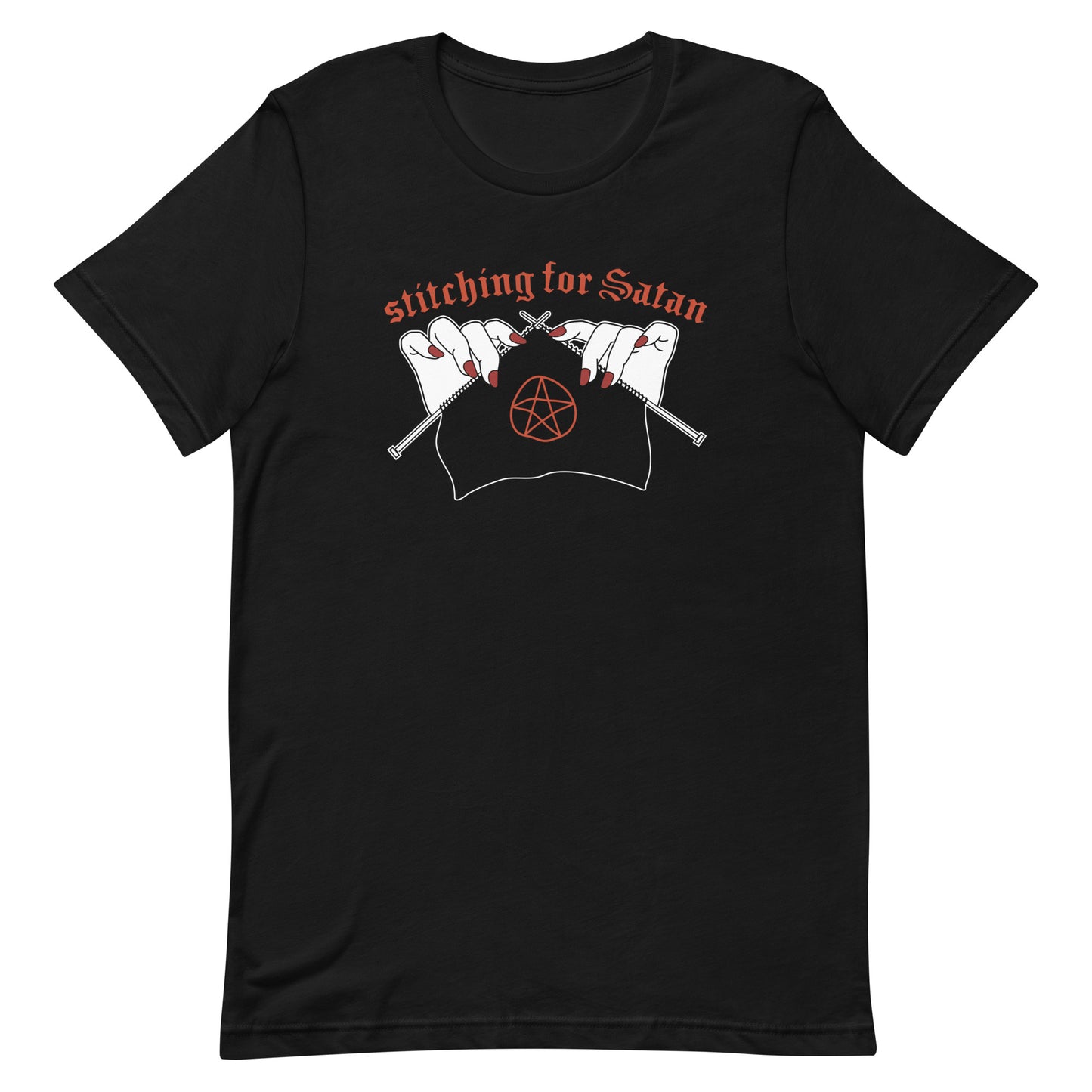 A black crewneck t-shirt featuring an illustration of pale white hands with red fingernails holding knitting needles. Fabric on the needles features a red pentagram. Text above the hands reads "stitching for Satan" in a gothc red font.