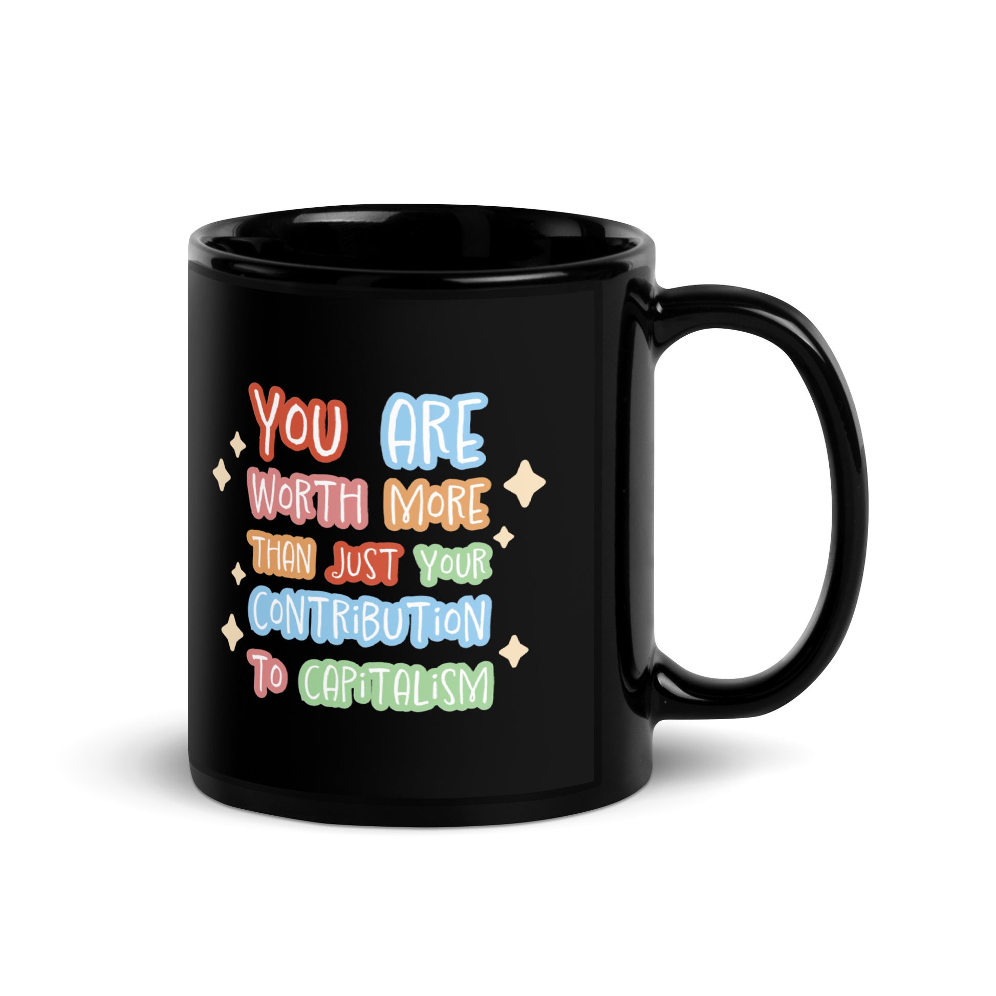 A black ceramic 11 ounce mug featuring colorful hand-written-style text that reads "You are worth more than just your contribution to capitalism". Sparkles surround the text on each side.