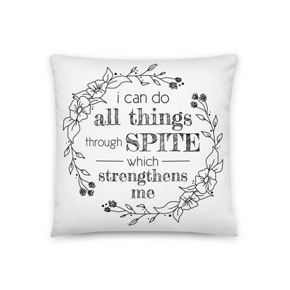 A white throw pillow decorated with an illustration of a floral wreath. Inside the flowers is text that reads "i can do all things through SPITE which strengthens me."