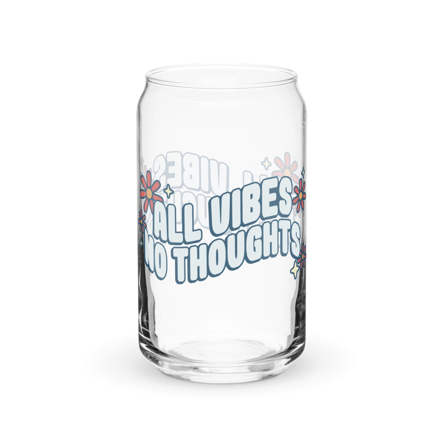 A can-shaped glass featuring text that reads "All vibes no thoughts". Around the text are pink flowers and pale yellow sparkles.