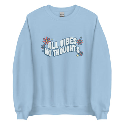 A light blue crewneck sweatshirt featuring text that reads "All vibes, no thoughts". Around the text are a few pink flowers and pale yellow sparkles.