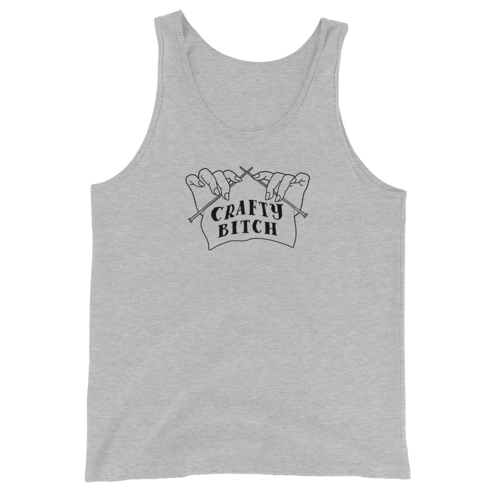 A light grey tank top featuring a single-color illustration of a pair of hands holding knitting needles. Fabric on the needles features text that reads "crafty bitch".
