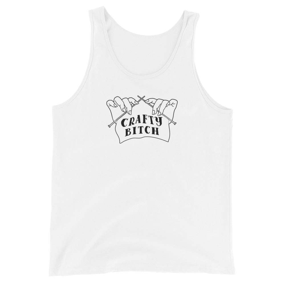 A white tank top featuring a single-color illustration of a pair of hands holding knitting needles. Fabric on the needles features text that reads "crafty bitch".