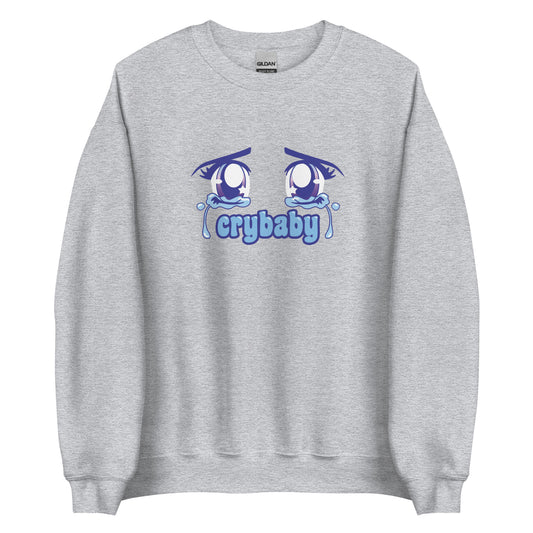 A grey crewneck sweatshirt featuring large, sparkling purple anime eyes with tears streaming down. Text underneath the eyes in a rounded blue font reads "crybaby"