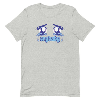 A grey crewneck t-shirt featuring large, sparkling purple anime eyes with tears streaming down. Text underneath the eyes in a rounded blue font reads "crybaby"