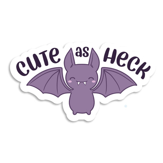 A diecut sticker featuring a cutesy, smiling purple bat. Text above the bat's wings reads "Cute as heck"