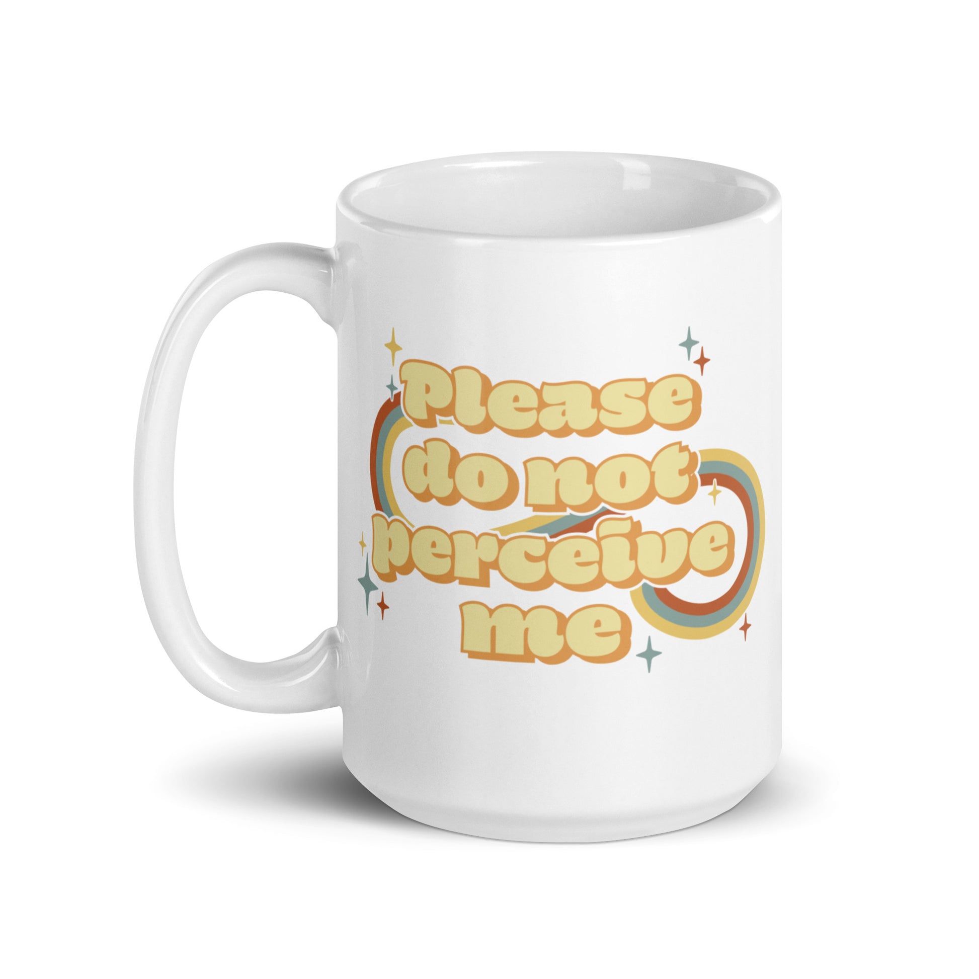 An 15 ounce white ceramic mug featuring vintage-style text that reads "Please do not perceive me". A colorful swirl and sparkles surrounds the text in red, yellow, and blue.