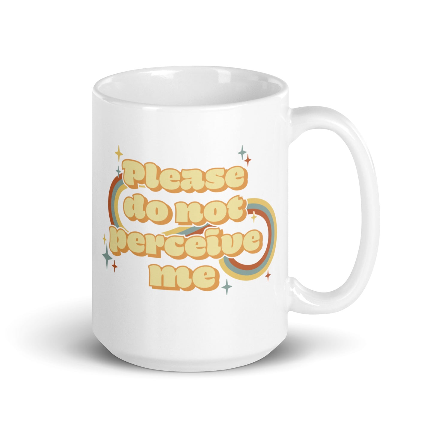 An 15 ounce white ceramic mug featuring vintage-style text that reads "Please do not perceive me". A colorful swirl and sparkles surrounds the text in red, yellow, and blue.