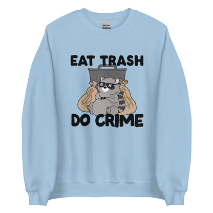 A light blue crewneck sweatshirt featuring an illustration of a chubby raccoon wearing sunglasses. The raccoon is leaning back against a trashcan and two large bags of money. Text surrouding the image reads "Eat Trash. Do Crime."