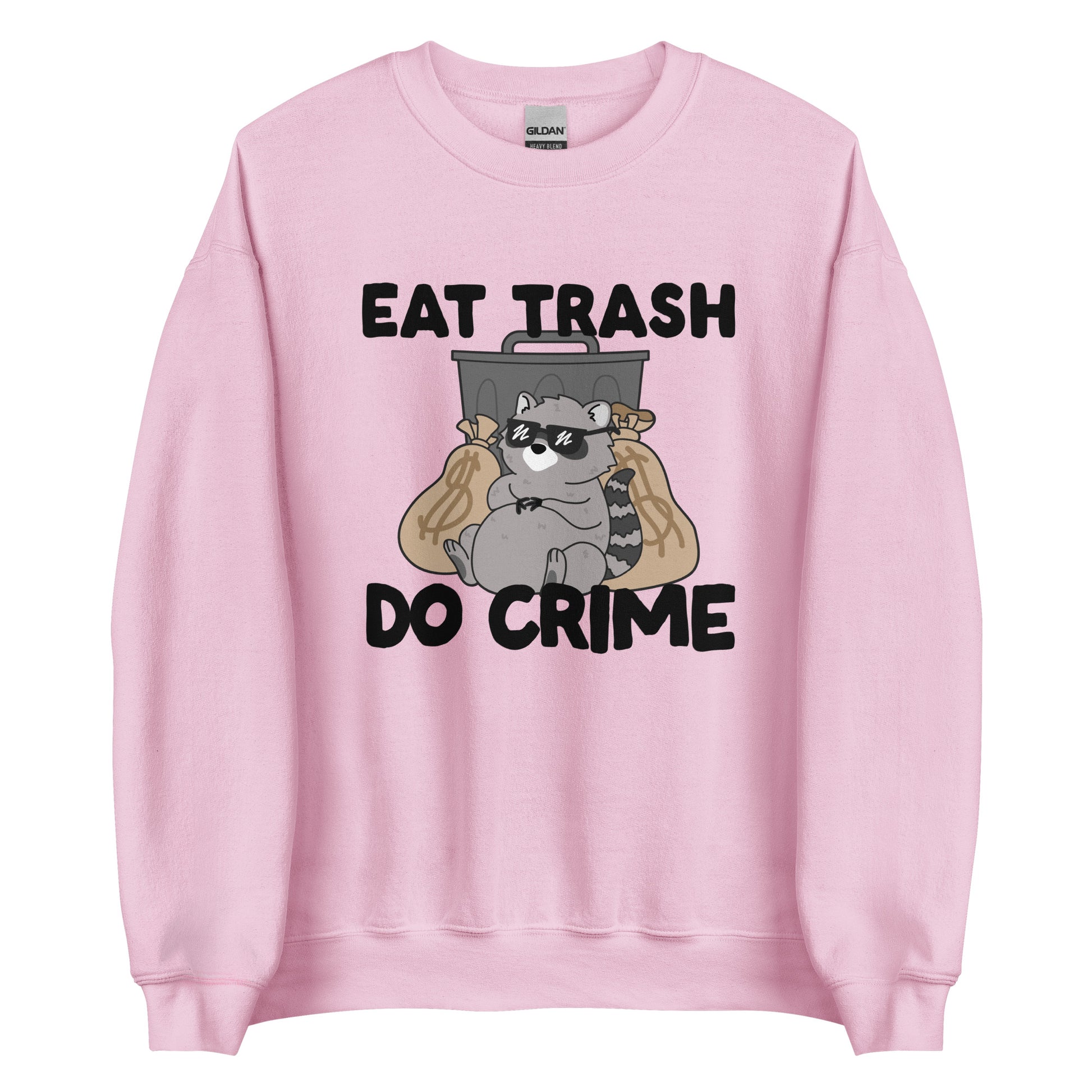 A light pink crewneck sweatshirt featuring an illustration of a chubby raccoon wearing sunglasses. The raccoon is leaning back against a trashcan and two large bags of money. Text surrouding the image reads "Eat Trash. Do Crime."