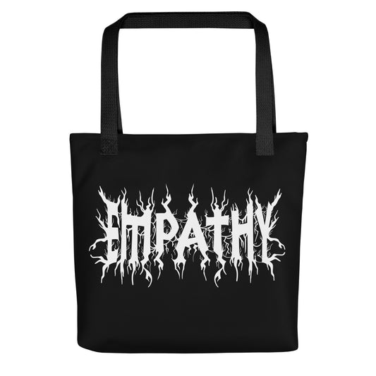 A black tote bag with black handles featuring white text that reads "Empathy" in a jagged font in the styel of heavy metal band shirts.