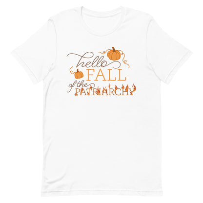 A white crewneck t-shirt featuring text that reads "Hello fall of the patriarchy". Pumpkins surround the first half of the text and the word "patriarchy" is on fire.