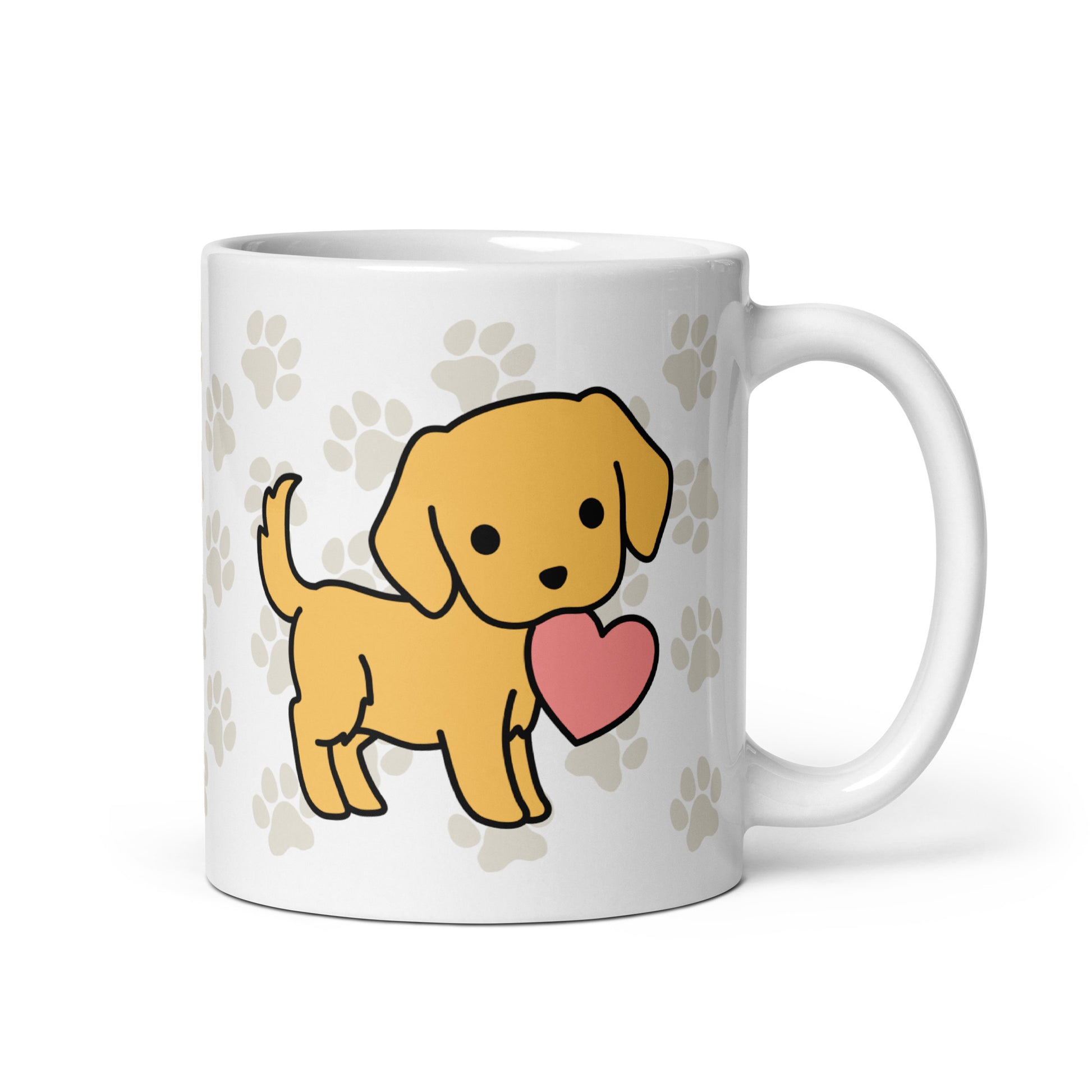 A white 11 ounce ceramic mug with a pattern of light brown pawprints all over. The mug also features a stylized illustration of a Golden Retriever holding a heart in its mouth.