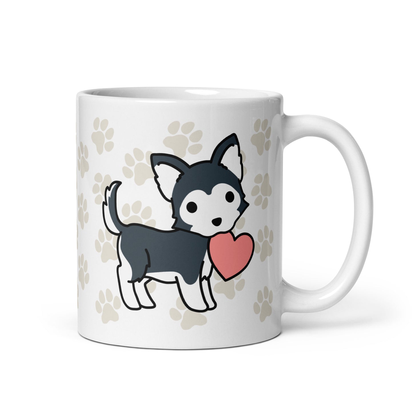 A white 11 ounce ceramic mug with a pattern of light brown pawprints all over. The mug also features a stylized illustration of a Husky holding a heart in its mouth.