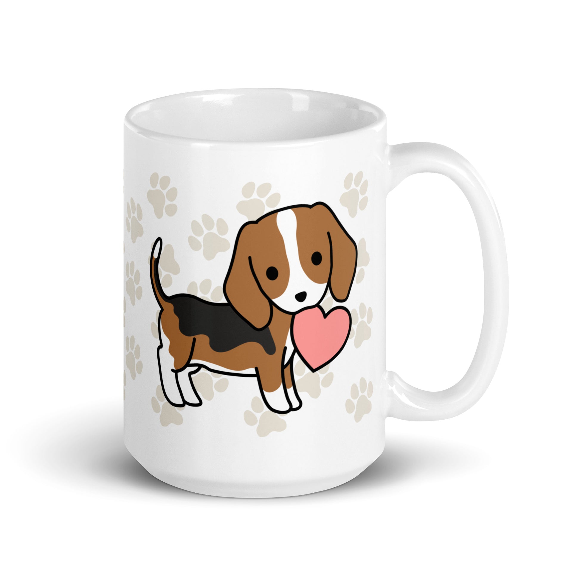 A white 15 ounce ceramic mug with a pattern of light brown pawprints all over. The mug also features a stylized illustration of a Beagle holding a heart in its mouth.