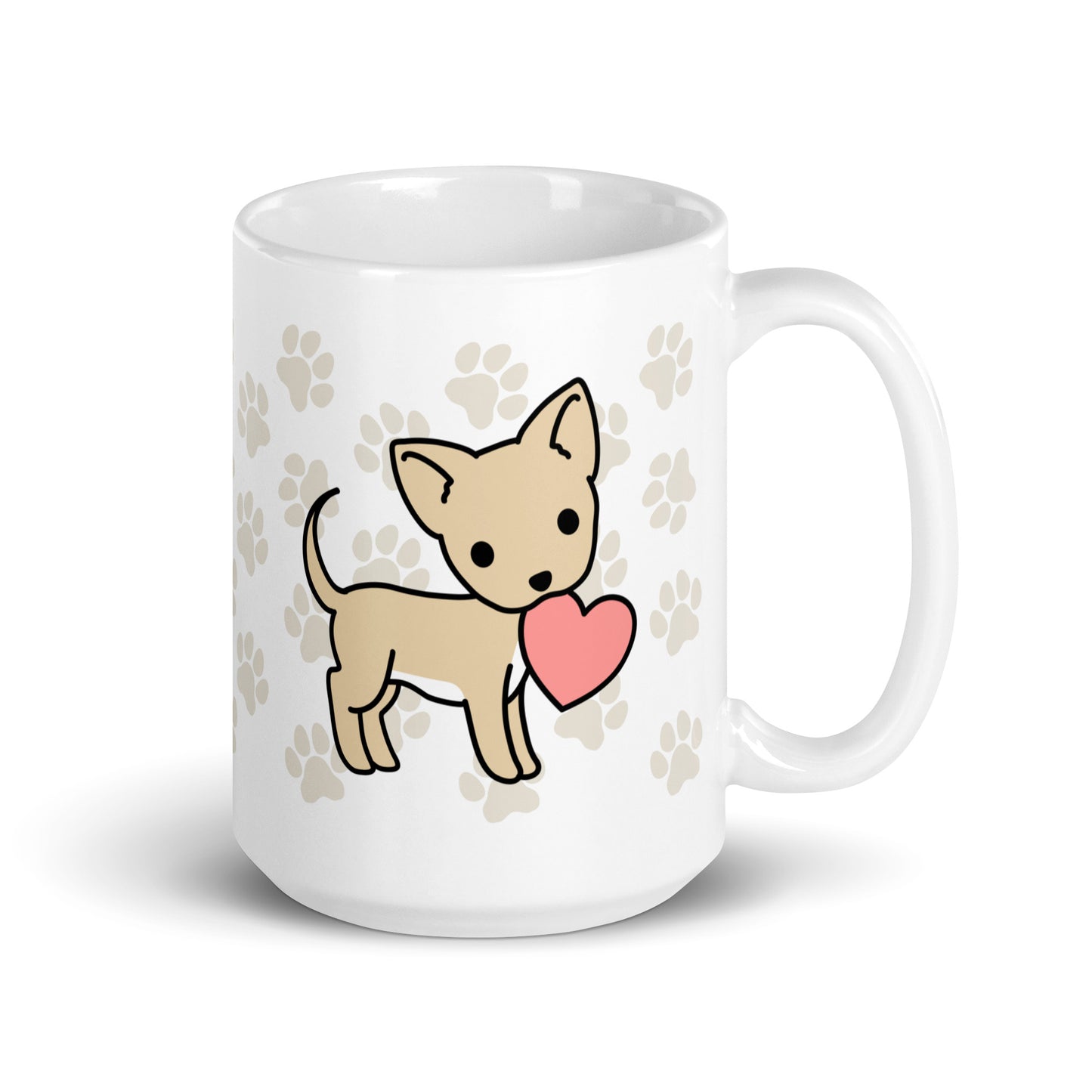 A white 15 ounce ceramic mug with a pattern of light brown pawprints all over. The mug also features a stylized illustration of a Chihuahua holding a heart in its mouth.