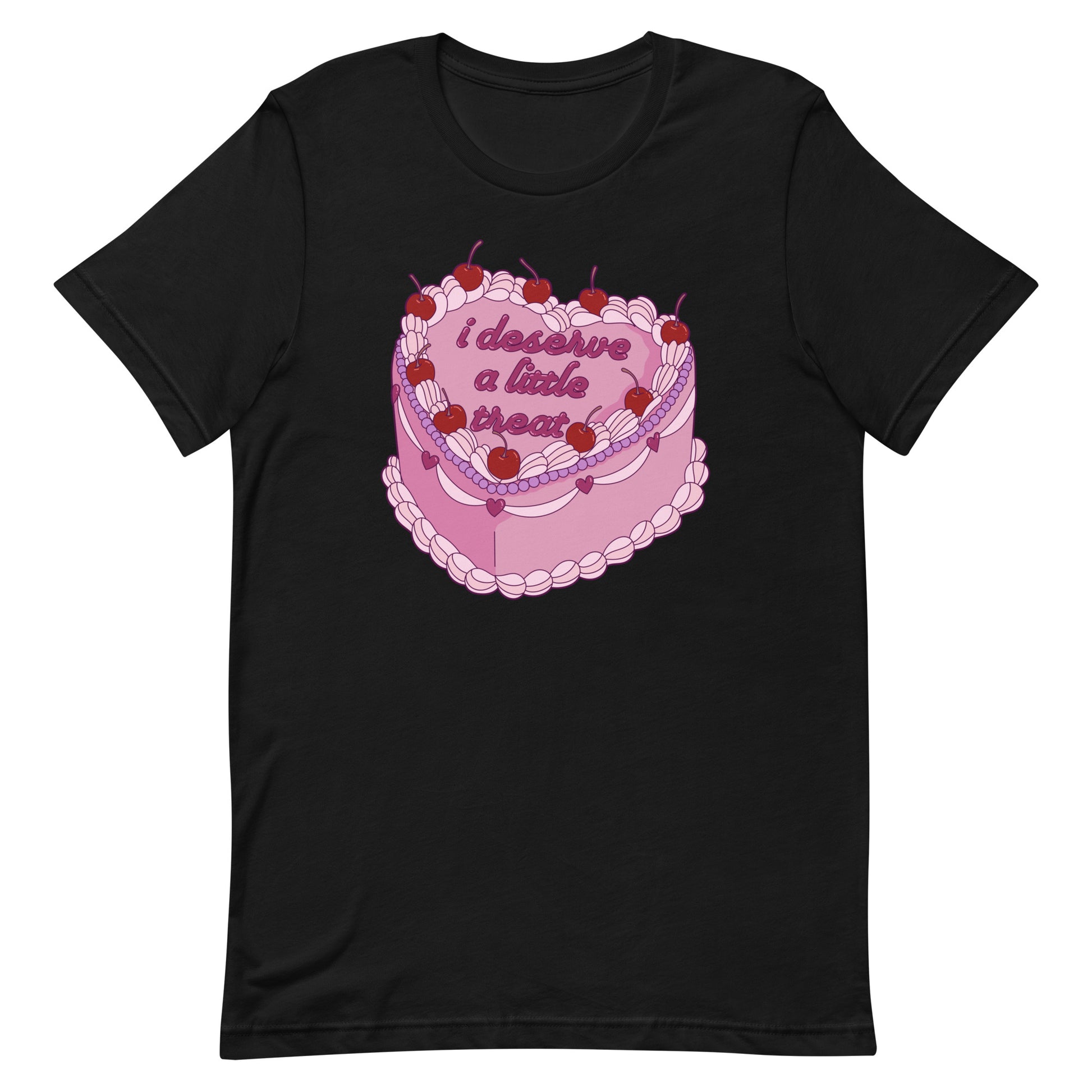 A black crewneck t-shirt featuring an illustration of an elaborately decorated pink cake. Icing on the cake reads "i deserve a little treat" in a cursive font.