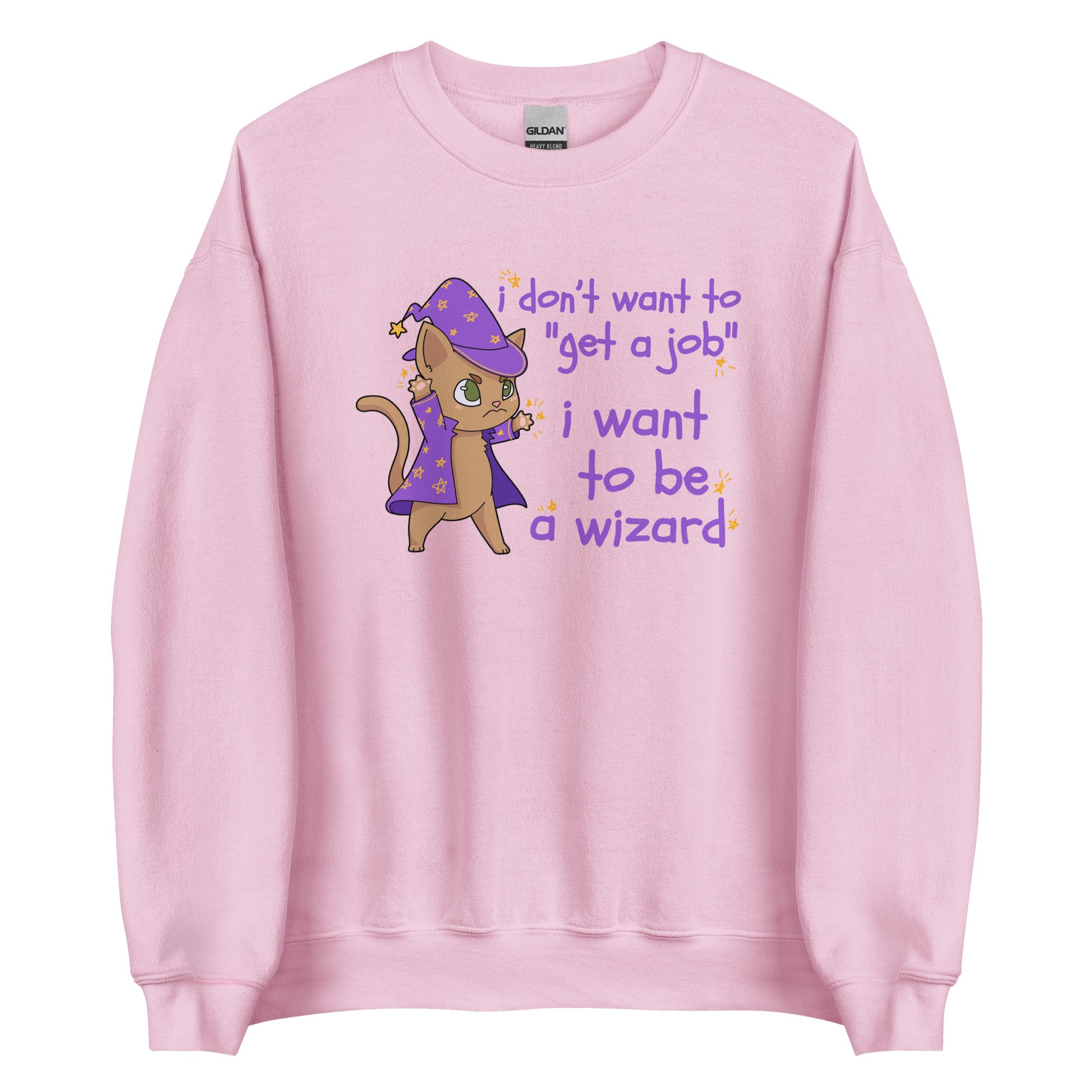 A light pink crewneck sweatshirt featuring an illustration of a small cat wearing wizard robes and a hat. Text alongside the cat reads "i don't want to "get a job". i want to be a wizard."