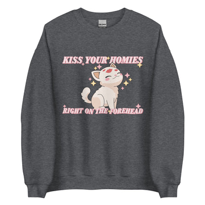 A dark heathred grey sweatshirt featuring an illustration of a soft white kitten. Lipstick kiss marks are on the kitten's forehead, and its face is surrounded by sparkles. Pink text around the kitten reads "Kiss your homies right on the forehead."