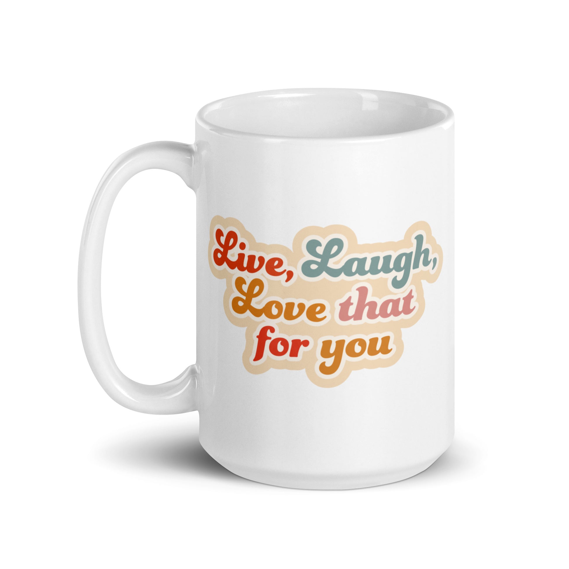 A white 15 ounce cereamic coffee mug featuring colorful, cursive text that reads "Live, Laugh, Love that for you."