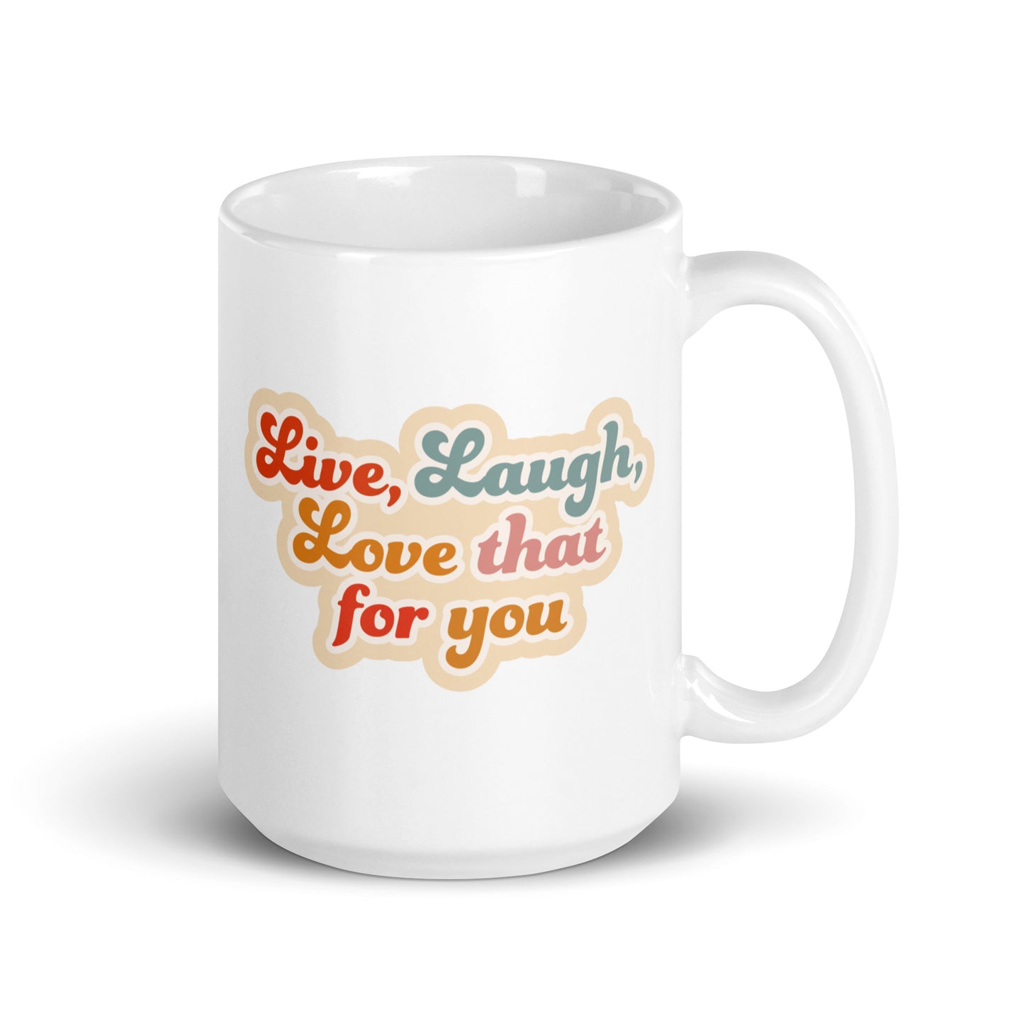 A white 15 ounce cereamic coffee mug featuring colorful, cursive text that reads "Live, Laugh, Love that for you."