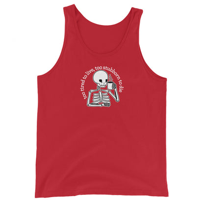 A red tank top featuring a tired-looking skeleton holding a steaming mug. Text above the skeleton in an arc reads "too tired to live, too stubborn to die"