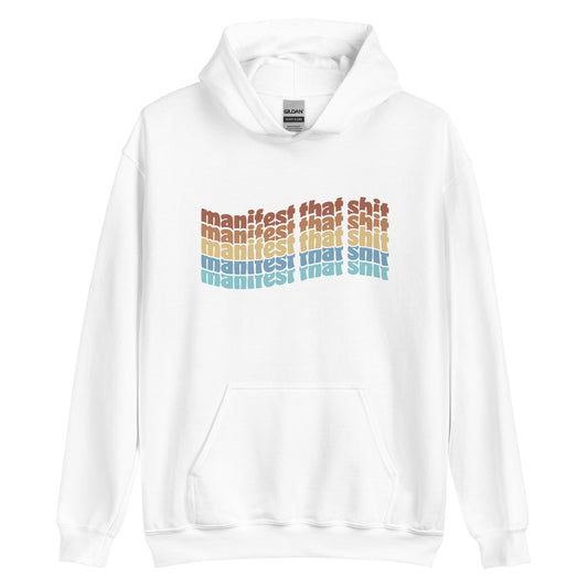 A white hooded sweatshirt featuring stacked text that reads "manifest that shit" in a rainbow of colors.