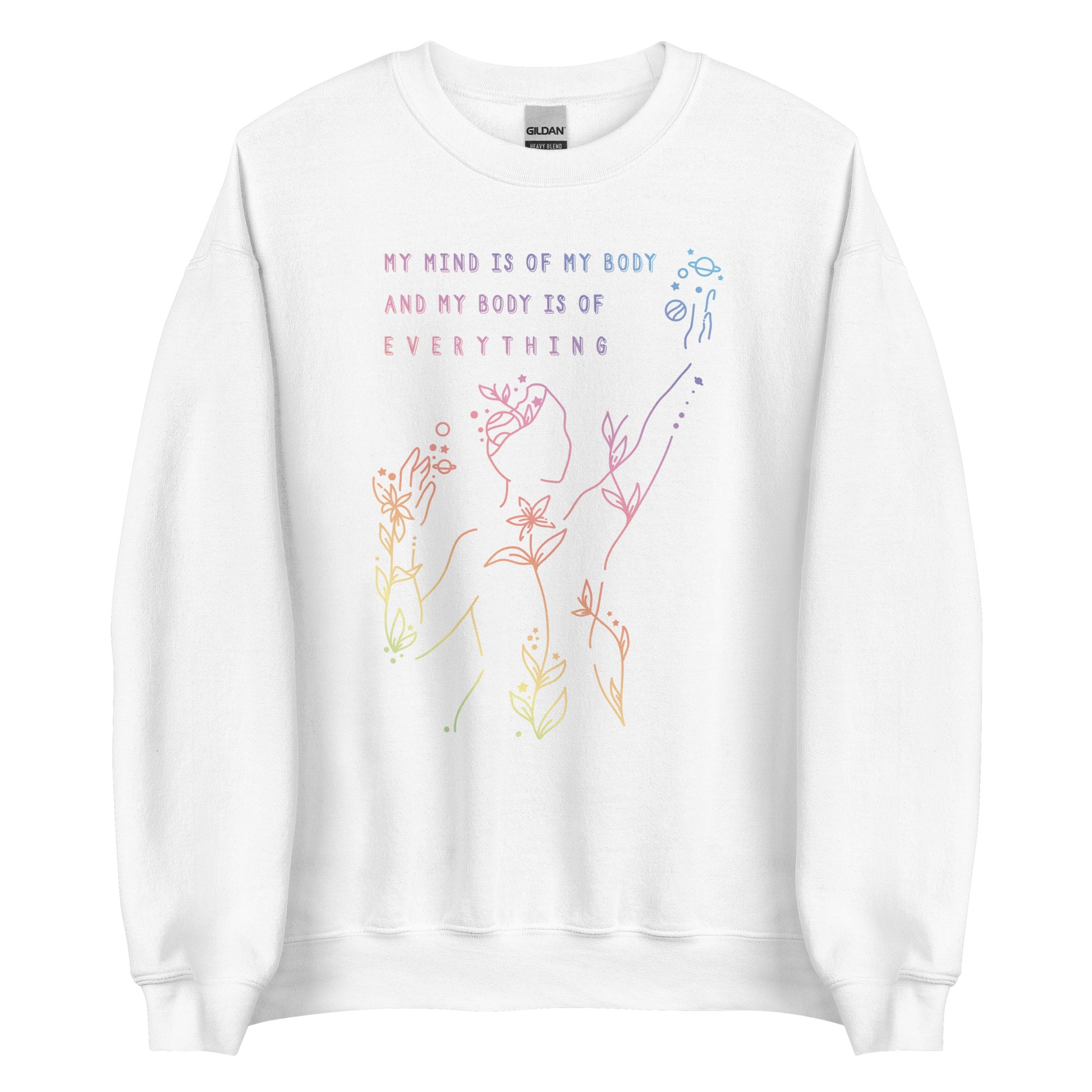 A white crewneck sweatshirt featuring an abstract illustration of a figure whose body is spreading out into plants and planets and stars. Text above the figure reads "My mind is of my body and my body is of everything."