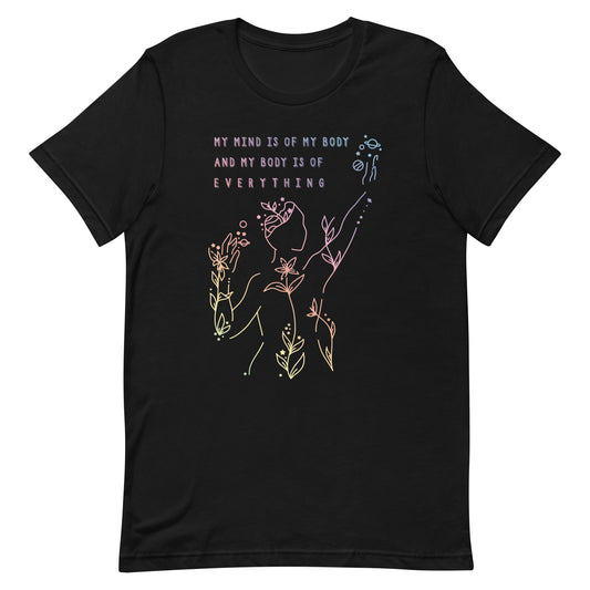 A black crewneck t-shirt, featuring an abstract illustration of a figure whose body is spreading out into plants and planets and stars. Text above the figure reads "My mind is of my body and my body is of everything."